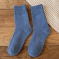 Cozy blue thermal wool blend crew socks with ribbed cuffs on rustic wooden background - One Size / Blue