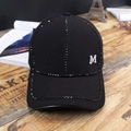 Black baseball cap for women with rhinestones and silver M letter on wooden table - M Label Black