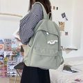 Vista laterale dello zaino in nylon verde chiaro con ciondolo a forma di cagnolino - 19 Pollici / Verde