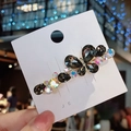 Funkelnde Schmetterling-Haarklammer mit grauen Kristallen und goldenem Metallfinish - Einzelstück / Schwarz