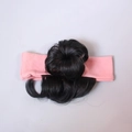 Detail of synthetic black hair bun and soft pink knitted headband for infants and girls - Single Bun / Pink