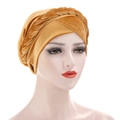 Detailed view of ginger gold velvet turban hat featuring a braided twist design and soft texture - Gold