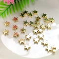 Macro shot of 14K gold filled star-shaped spacer beads for DIY jewelry making - Star 7mm / 14K Gold Plated