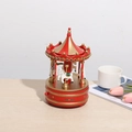 Classic red and gold wooden carousel music box on a desk for Christmas home decor - Red