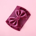 Detail view of large burgundy velvet bow on an elastic bohemian baby headband - Dark Red
