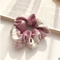 Pink and off-white checkered organza scrunchie displayed on an open vintage book - Raspberry Tea Pink Beige Grid