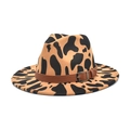 Detail of wide brim fedora hat featuring cow print pattern and leather band with metal buckle - M (56-58cm) / Camel