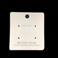 Macro detail of white jewelry earring display card measuring 6.7x6.2 cm with four holes - Earring Card #6 (Approx. 100Pcs)