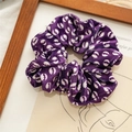 Purple velvet hair scrunchie with white circular pattern on artistic background - Purple Bat