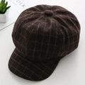 Close-up of retro dark brown plaid wool newsboy cap on a white table with folk books - M / Plaid Style / Plaid Brown