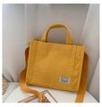 Bright yellow corduroy tote bag with adjustable shoulder strap and woven label - Yellow