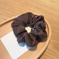 Retro dark brown corduroy hair scrunchie in a stylish wooden tray presentation - Brown