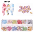Macro shot of 12-slot box containing colorful daisy wood pulp nail art floral sequins - 12 Grids Wood Pulp Decals 07-Colorful Daisy Series (MJP-07)