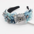 Detailed macro view of baroque headband with blue lace flowers, pearls and crystals - Blue