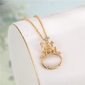 18k gold plated cat eye necklace with a crystal dream castle pendant on white display - Cable Chain