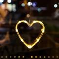 Warm yellow heart-shaped LED hanging window light with clear cord for holiday decor - Christmas Heart