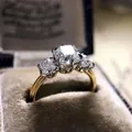 Vintage three-stone gold ring with cushion-cut zircon in a dark velvet jewelry box - Cy786 / Size 5
