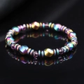 Magnetarmband mit Regenbogenperlen, lila Facettensteinen und Gold-Teilern auf schwarzem Grund - Einreihig facettierte Perlen / Regenbogen