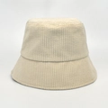 Detailed view of beige corduroy bucket hat with vertical ribbing texture and neat stitching - M (56-58cm) / Beige