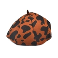 Close-up of brown cow print wool beret hat featuring vintage retro patterns and soft texture - M (56-58cm) / Caramel color
