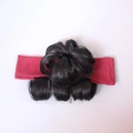 Detail of red fabric headband with integrated black curly synthetic hair bun for toddlers - Single Bun / Purplish Red