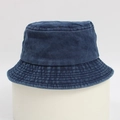 Navy blue washed cotton bucket hat with vintage texture on a minimal grey pedestal - One Size / Navy Blue
