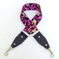 Close-up of pink leopard print adjustable bag strap with golden buckles and rivets - Rose Red
