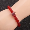 Faceted red agate beaded bracelet with rose gold crown charm and pink crystals - Red/Rose Gold Crown