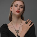 Gothic spider jewelry set with green emeralds including necklace, earrings, and ring - Black Spider Jewelry Three-piece Set