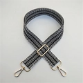 Detail of adjustable black and white geometric strap with gold-tone metal hooks - Gold Buckle / Black