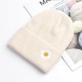 Creamy white ribbed knit beanie hat with embroidered daisy flower on the folded cuff - Off White