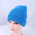 Detailed close-up of bright blue knitted beanie with fine vertical ribbing and wide cuff - One Size / Lake Blue