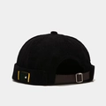 Detail of black corduroy docker hat featuring adjustable brown leather back strap - M (56-58cm) / Black