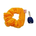 Orange velvet scrunchie with hidden pocket shown next to a key for size reference - Gold