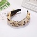 Detail of bohemian wide knotted headband with gold leaf embroidery and vintage pattern - Beige