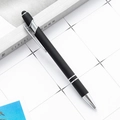 Silver and black retractable stylus pen with metal clip on a white grid surface - Black