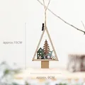 Detail of wooden Christmas tree ornament with carved reindeer and forest, 15x9cm size - Christmas House