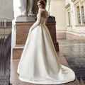 Elegant ivory lace long sleeve wedding dress with heavy satin train and hidden pockets - US 2 / White