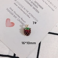 Detailed view of a 16x10mm red enamel strawberry charm with gold plating for DIY jewelry - 7# (16*10mm 3D)