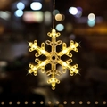 Warm white snowflake LED suction cup light with glowing star effect for Christmas windows - Christmas Snow