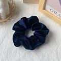 Dark blue velvet scrunchie accessory shown in a minimalist setting for daily hair styling - Dark Blue