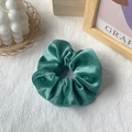 Elegant emerald green velvet scrunchie for hair styling with soft plush texture - Emerald Green