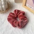 Velvet hair scrunchie in dusty rose color with premium glossy texture and soft folds - Coral