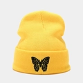 Close-up of black butterfly embroidery on a bright yellow ribbed knit beanie hat - M (56-58cm) / Yellow