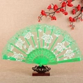 Elegant green lace folding fan with white rose pattern on decorative plastic ribs - Fan / Green