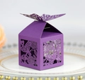 Macro detail of purple laser-cut butterfly gift box showing intricate floral hollow patterns - Deep purple