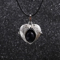 Detail view of heart pendant with silver wings and black bead on necklace cord - Black (Blue Sandstone)