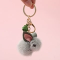 Cute gray plush rabbit keychain with gold hardware and green bell accessory - Animal Keychain / Green Bunny