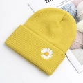 Bright yellow knit beanie featuring delicate white daisy embroidery and ribbed texture - Yellow