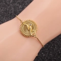 Detail of adjustable gold snake pendant bracelet with sparkling central zircon on wrist - Box Chain Snake 5